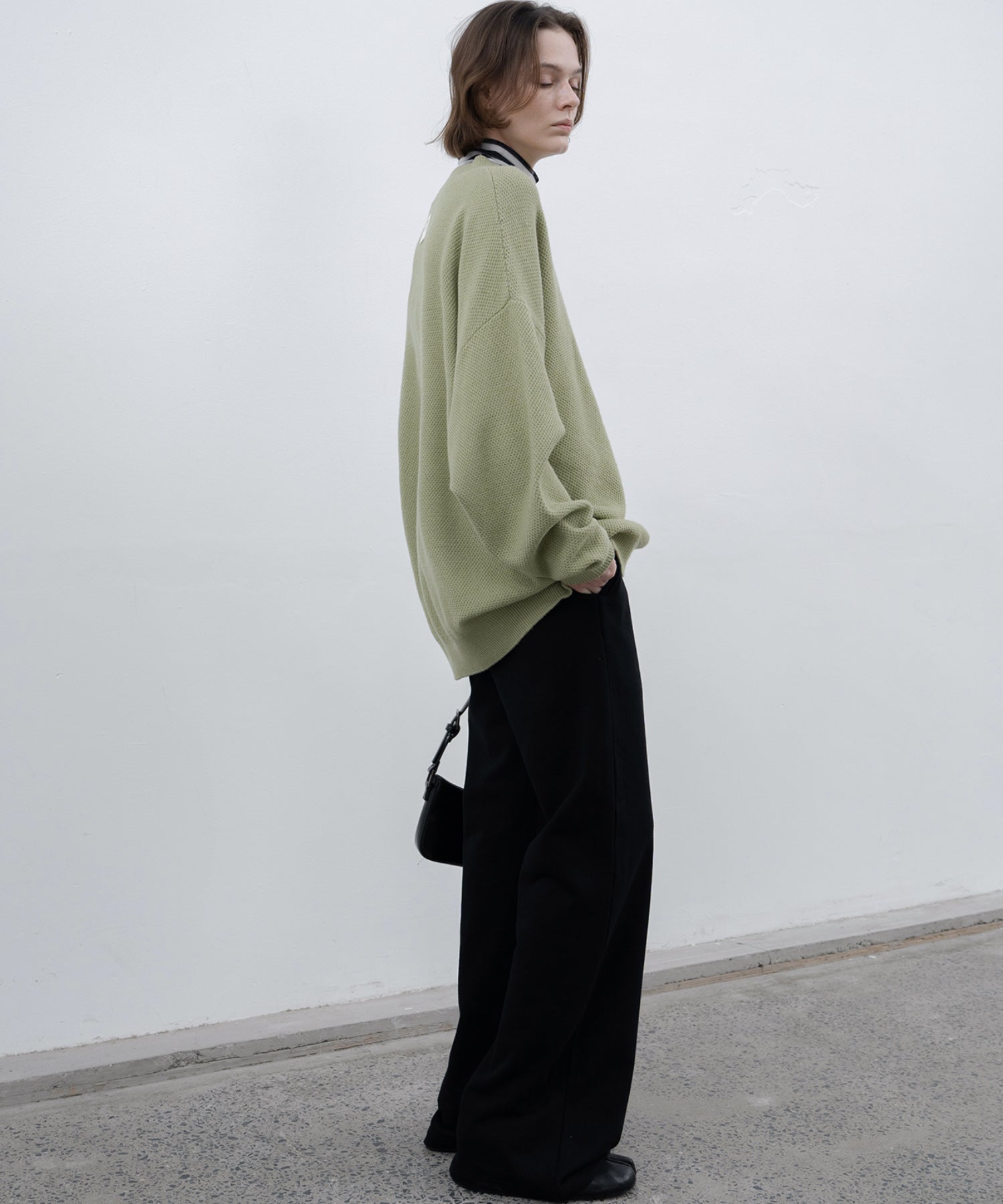 Round slit asymmetric design knit 